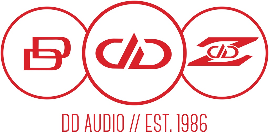 DD AUDIO Heritage T-Shirt 2025 - Graphic showing Classic DD logo, Modern DD logo, and "Z" DD logo with words "DD AUDIO // Est. 1986"